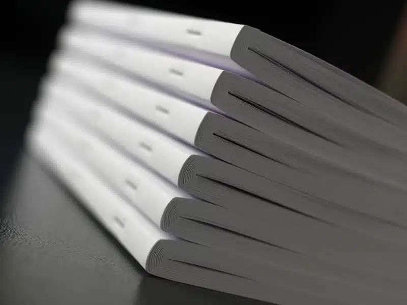 6 book stacks that have been created using squareback saddle stitching